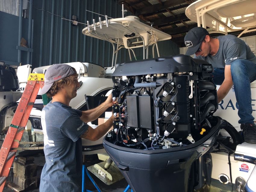 Marine technicians working on equipment